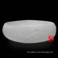 white freestanding sandstone bathtub